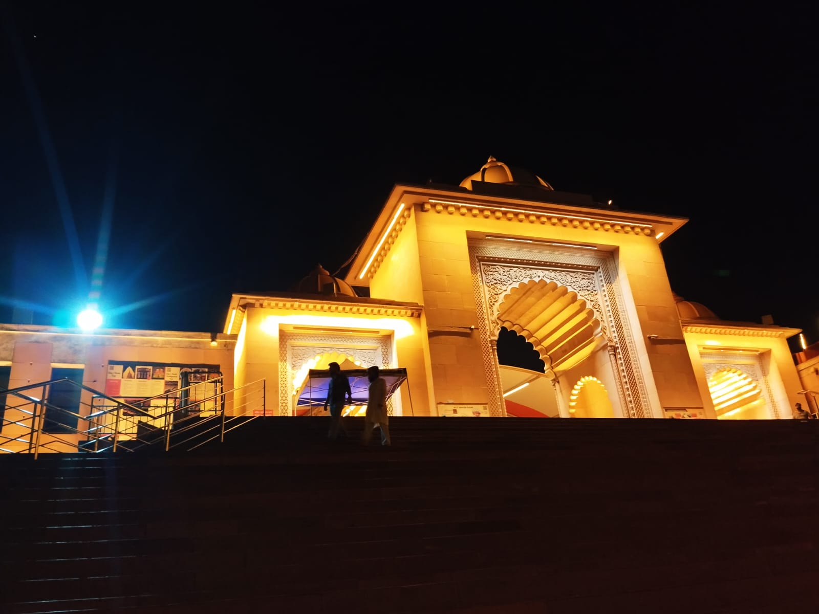 Temple entrance lit up at night, North India pilgrimage